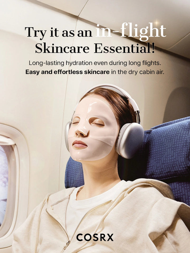 Person wearing a face mask and headphones on an airplane with COSRX branding.