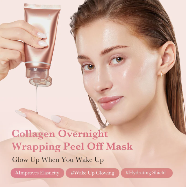 A woman with glowing, hydrated skin receives a drop of mask cream from a metallic rose gold squeeze tube held by another hand. The background is a soft, solid pale pink.